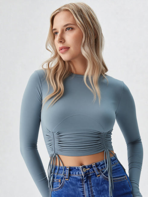 Blue ruched long sleeve crop top with drawstring detail and crew neck