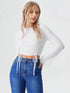 White ruched side tie long sleeve crop top on model, polyester chic women’s top
