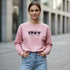 Pink cotton sweatshirt with a bold 1967 front graphic worn by a woman