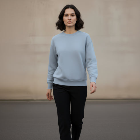 Light blue minimal crewneck sweatshirt worn by a woman