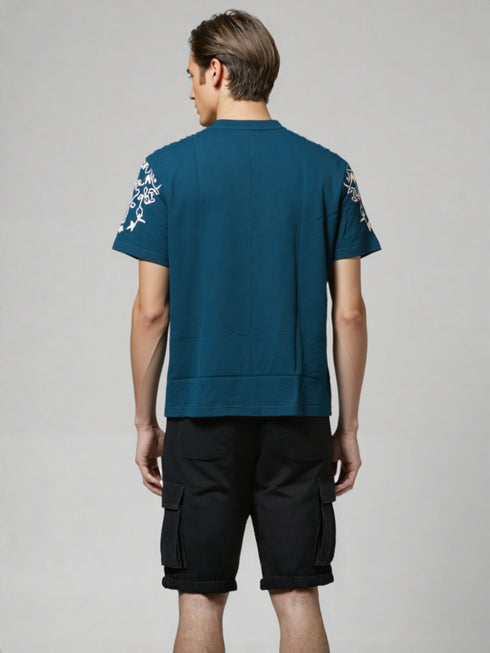 Teal Oversized T-Shirt with bold white floral graphic design