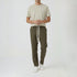 Man wearing olive green baggy fit cotton trousers with white t-shirt