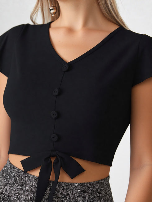 Black flutter sleeve button tie-front crop top on model, polyester chic women’s top