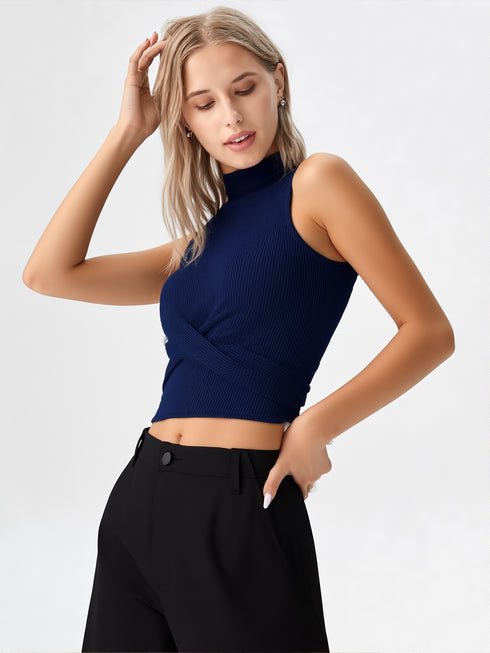 Close-up of woman wearing navy blue mock neck sleeveless ribbed top with crossover waist design