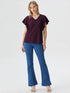 Purple flutter sleeve V-neck top on model, lightweight polyester blouse