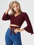Maroon wrap crop top with flared long sleeves and tie waist in polyester fabric, stylish women’s evening wear