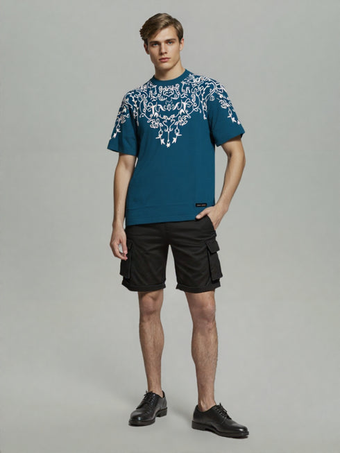 Teal Oversized T-Shirt with bold white floral graphic design