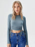 Blue ruched long sleeve crop top with drawstring detail and crew neck
