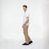 Beige baggy fit denim pants for men styled with white t-shirt and black shoes