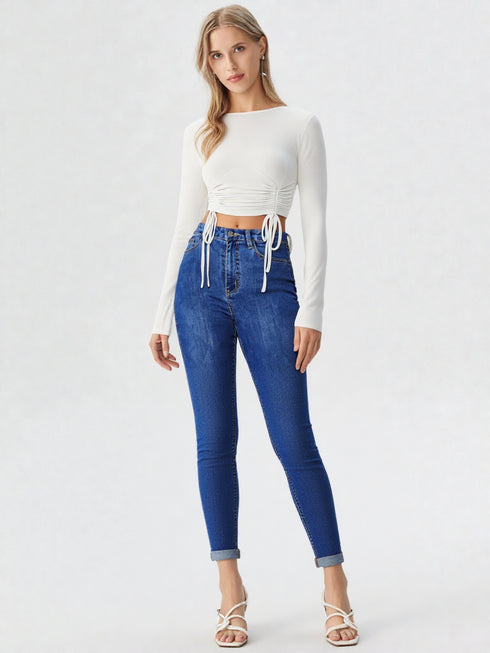 White ruched side tie long sleeve crop top on model, polyester chic women’s top