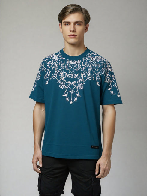 Teal Oversized T-Shirt with bold white floral graphic design