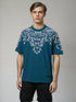 Teal Oversized T-Shirt with bold white floral graphic design