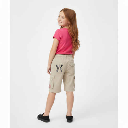 Beige cotton cargo shorts for kids with elastic waistband and side pockets
