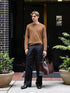 Men’s Brown Classic Crewneck Sweater paired with black trousers
