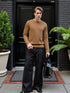 Men’s Brown Classic Crewneck Sweater paired with black trousers