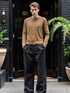 Men’s Brown Classic Crewneck Sweater paired with black trousers