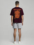 Maroon Oversized T-Shirt with bold orange "Break The Rules" back graphic