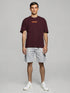Maroon Oversized T-Shirt with bold orange "Break The Rules" back graphic