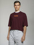 Maroon Oversized T-Shirt with bold orange "Break The Rules" back graphic