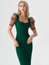 Woman wearing a green bodycon midi dress with embroidered puff mesh sleeves
