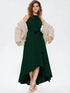 Woman wearing dark green halter neck asymmetrical maxi dress with tie waist belt and white heels