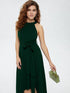 Woman wearing dark green halter neck asymmetrical maxi dress with tie waist belt and white heels