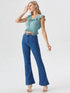Woman wearing sea green ruffle trim tie front crop top with high-waisted jeans