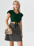 Woman wearing emerald green ruffle sleeve button front crop top with tie hem