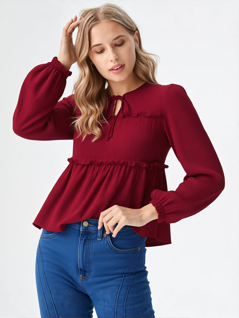 Maroon long sleeve smocked peplum top with tie-up neckline and flowy hem, women’s elegant casual wear