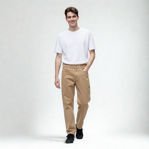 Beige baggy fit denim pants for men styled with white t-shirt and black shoes