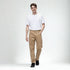 Beige baggy fit denim pants for men styled with white t-shirt and black shoes