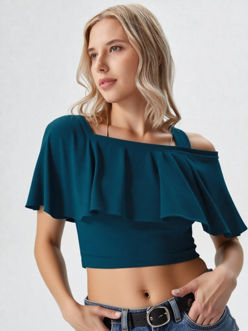 Woman wearing teal one-shoulder ruffle crop top with belted jeans