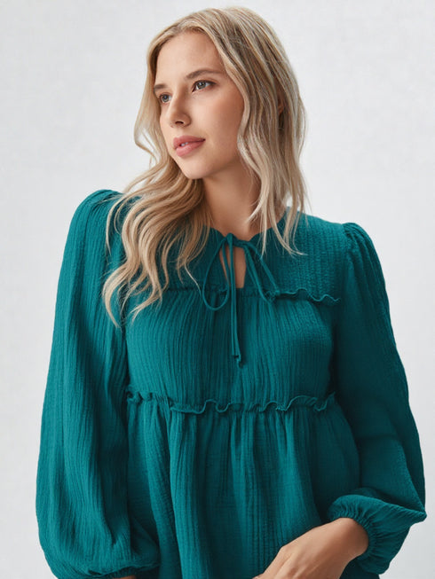 Teal peplum long sleeve top with tie-neck and puff sleeves