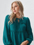 Teal peplum long sleeve top with tie-neck and puff sleeves