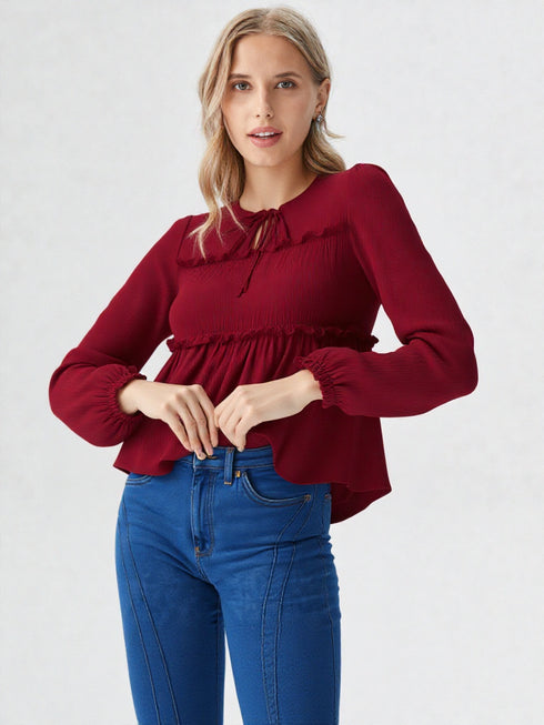 Maroon long sleeve smocked peplum top with tie-up neckline and flowy hem, women’s elegant casual wear