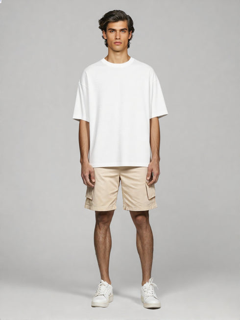 White Oversized Basic T-Shirt for men styled with beige shorts