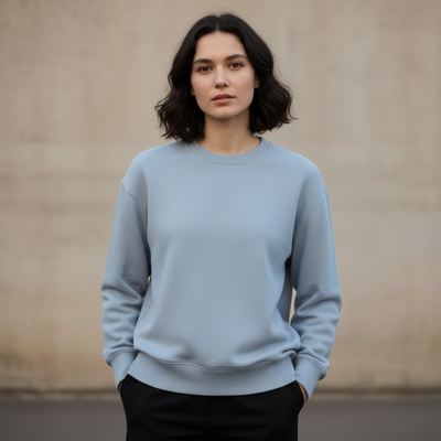 Light blue minimal crewneck sweatshirt worn by a woman