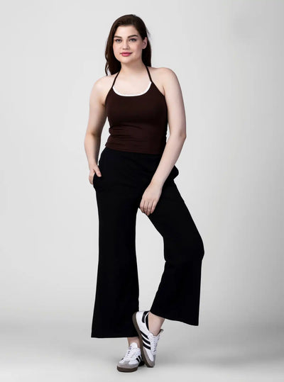 Woman wearing backless cami top with halter neckline